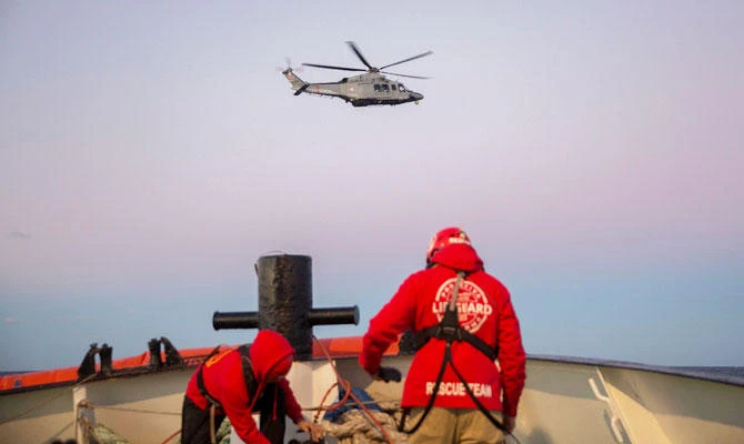 A rescue helicopter leaves after evacuating a mother and her new born baby following their rescue with other nearly 300 migrants off the coast of Libya on December 21, 2018 by Proactiva Open Arms organisation. (AFP)