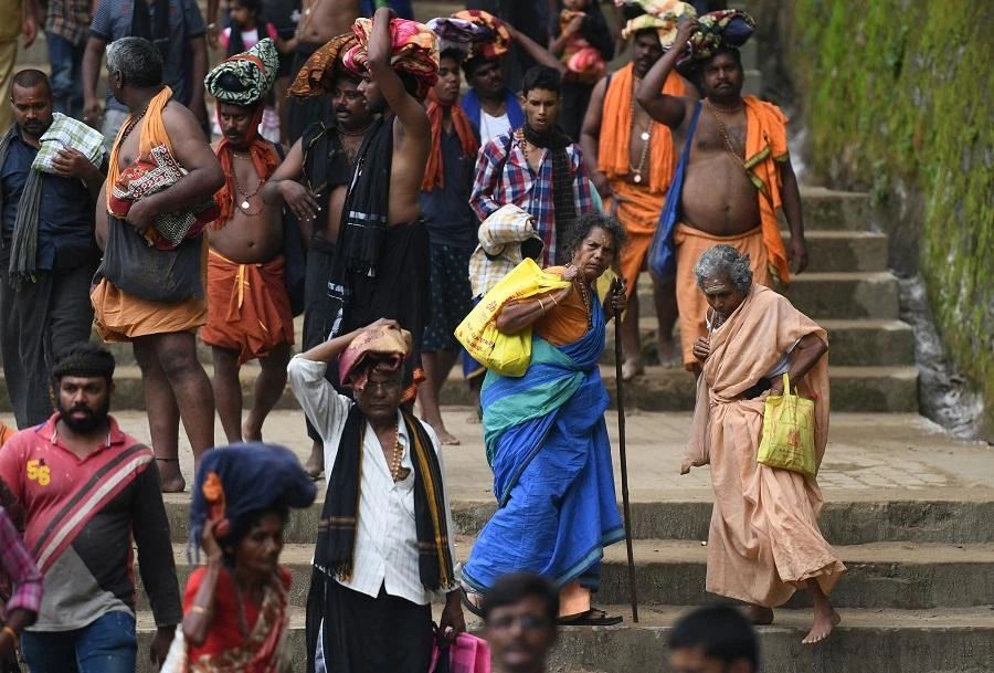 Pilgrims have to walk about four hours to reach the shrine but hundreds of protesters, including women, from across India blocked the path, noisily vowing not to let the women pass. (File/AFP)