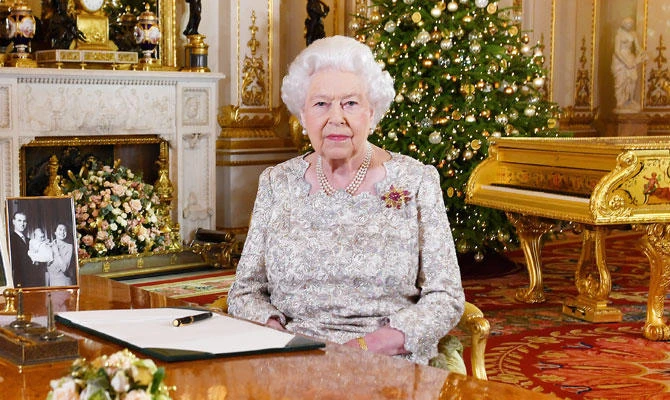 Britain's Queen Elizabeth poses, after recording her annual Christmas Day message in the White Drawing Room of Buckingham Palace, in central London, Britain, in this undated pool picture released on December 24, 2018. (REUTERS)