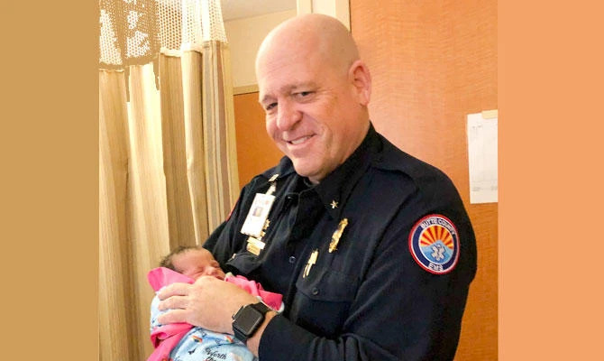 Woman names baby after medic who saved her during wildfire