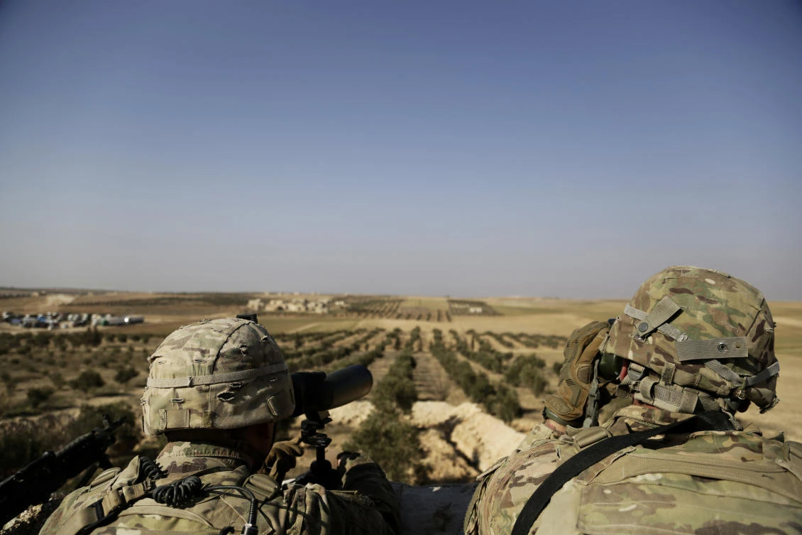 American troops look out toward the border with Turkey from a small outpost near the town of Manbij, northern Syria. (File/AP/Susannah George)