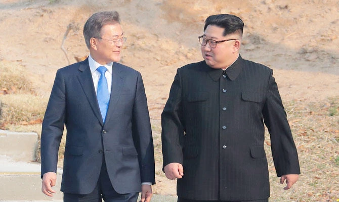 In this April 27, 2018 file photo, North Korean leader Kim Jong Un, right, and South Korean President Moon Jae-in stroll together at the border village of Panmunjom in the Demilitarized Zone, South Korea. (AP)