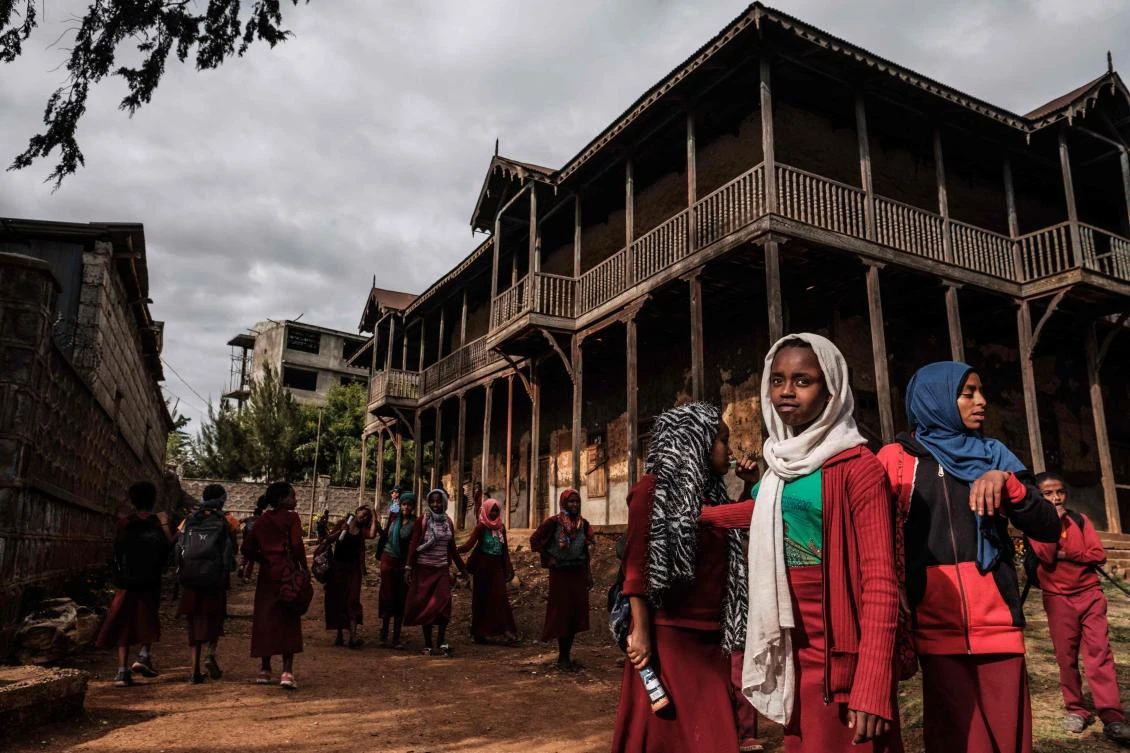 Students gather in the courtyard of the Sheik Ojele palace, which was built in 1890 and influenced by Indo-Islamic architectural design, and currently used as a residence combined with a school, on November 29, 2018, in Addis Ababa. (AFP)