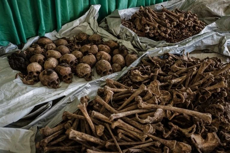 A picture taken on April 30, 2018, shows collected victims' bones and skulls from a newly discovered pit which was used as mass grave during 1994 Rwandan genocide and hidden under a house at the local administration office in Kabuga, the outskirts of Kigali, Rwanda. (AFP)