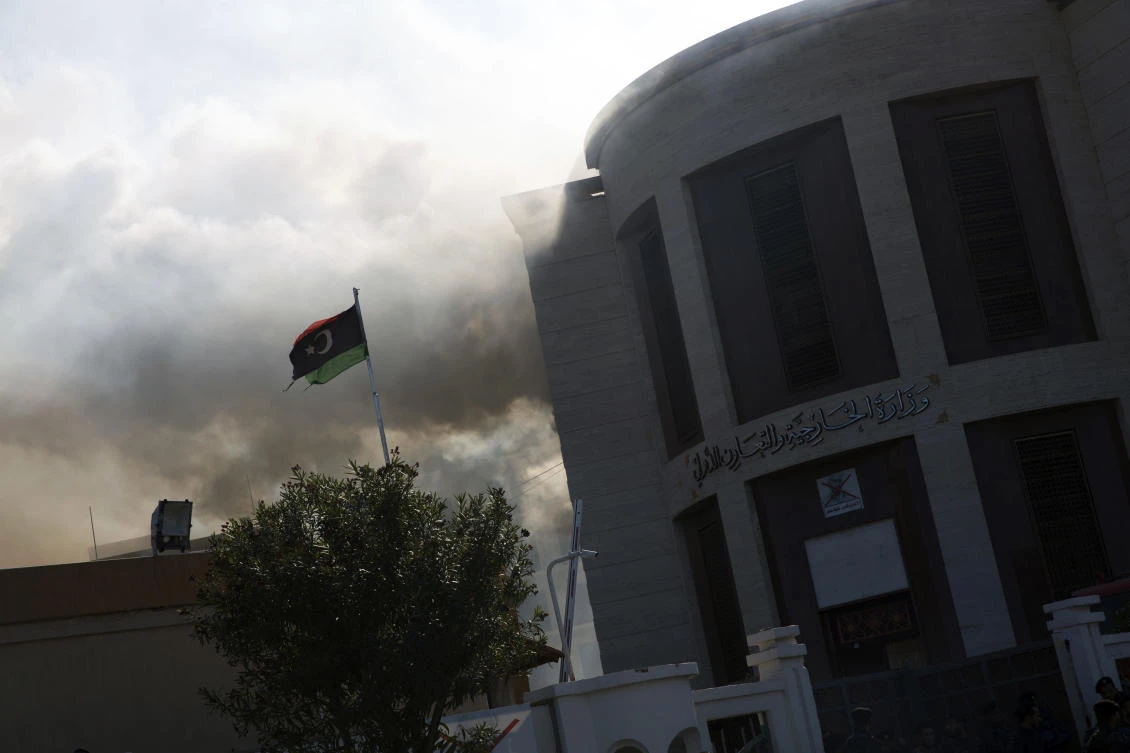 Smoke rises shortly after an attack on the foreign ministry building, in Tripoli, Libya, Tuesday, Dec, 25, 2018. (AP)