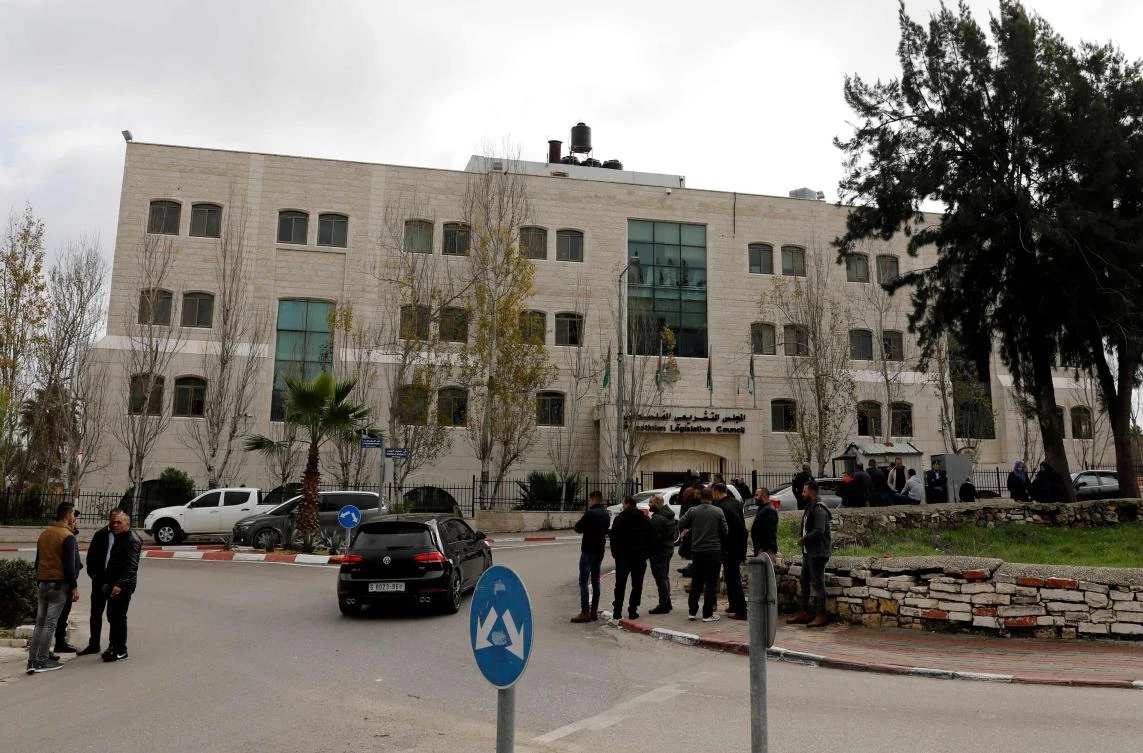 Palestinian security forces gather in front of the Palestinian Legislative Council building in Ramallah in the Israeli-occupied West Bank on December 26, 2018. (AFP)