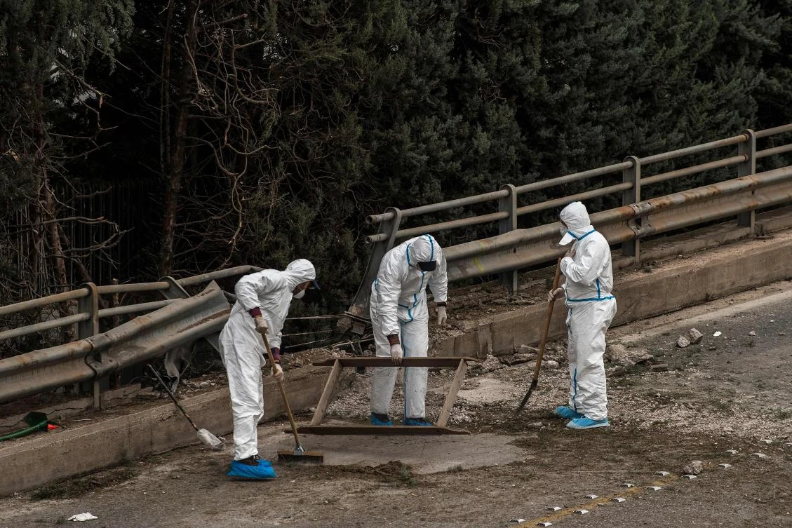 Greek police experts search for evidence after a bomb blast outside the Greece's SKAI TV building after a bomb blast in Athens on December 17, 2018. (File/AFP)