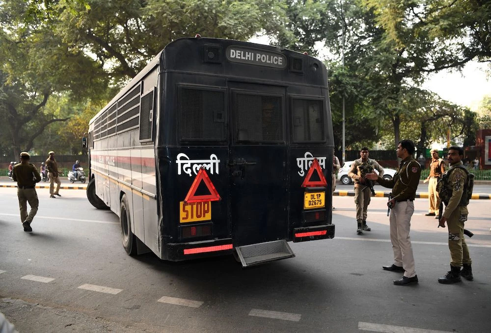 Indian police escort a bus carrying ten suspects of an obscure militant group "Harkat ul Harb-e-Islam" outside Patila Court in New Delhi on December 27, 2018. (AFP)