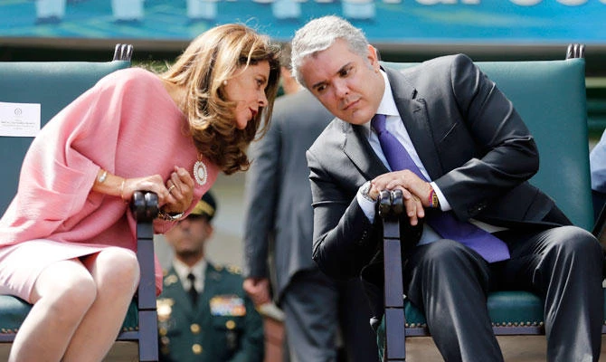 Colombia's President Ivan Duque right, and Vice President Marta Lucia Ramirez attend a swearing-in ceremony for the new military and police commanders, in Bogota, Colombia, Monday, Dec. 17, 2018. (AP)