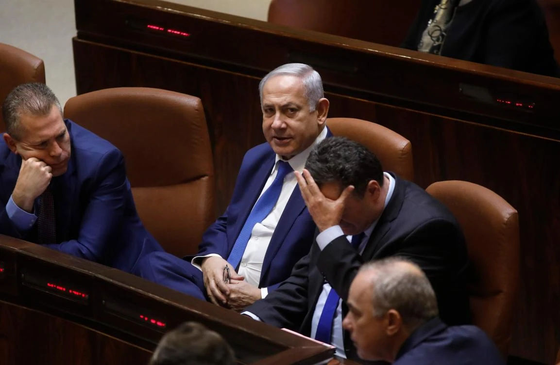 Israeli lawmakers gave initial approval to a bill to dissolve parliament and hold early elections on April 9 and it was expected to be finalized later in the evening. (AFP)
