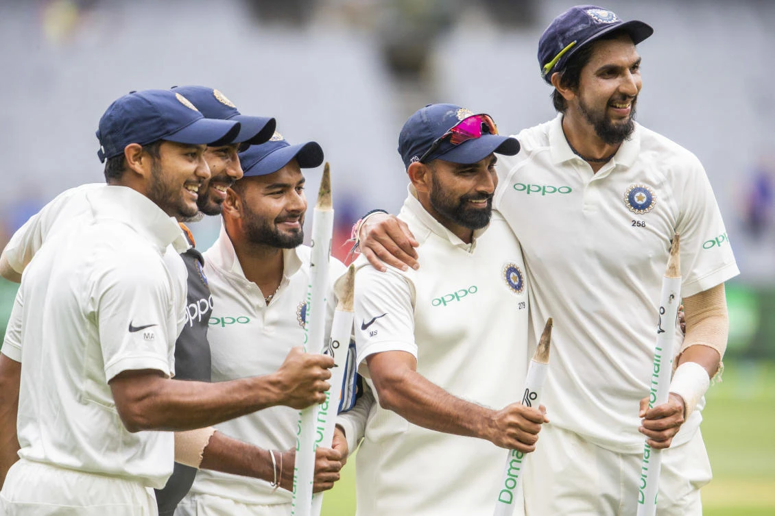 From left, India's Mayank Agarwal, Jasprit Bumrah, Rishabh Pant, Mohammed Shami and Ishant Sharma hold the stumps after India defeated Australia on day five of the third Test in Melbourne. (AP)