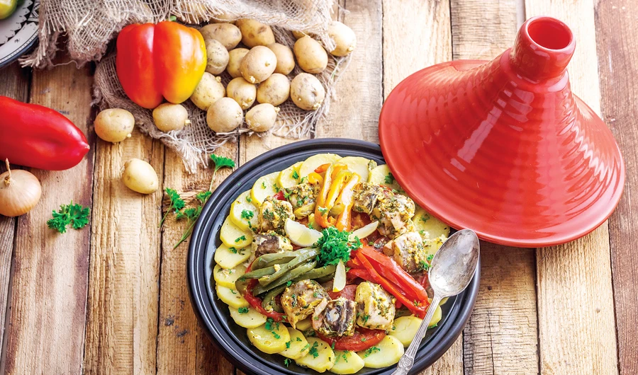 Moroccan tajine dishes are slow-cooked savory stews, typically made with sliced meat, poultry or fish together with vegetables or fruit.