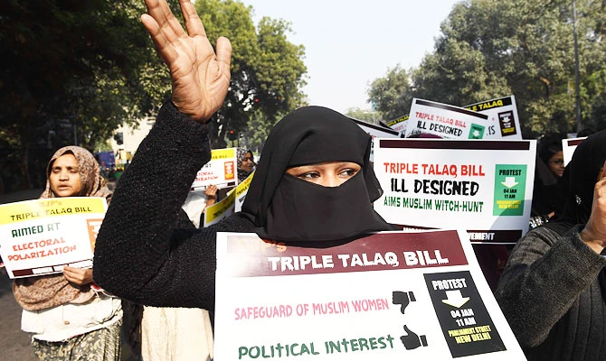 Activists of Women India Movement (WIM) shout slogans as they hold placards against proposed 'Triple Talaq Bill' during a protest in New Delhi on January 4, 2018. (AFP)