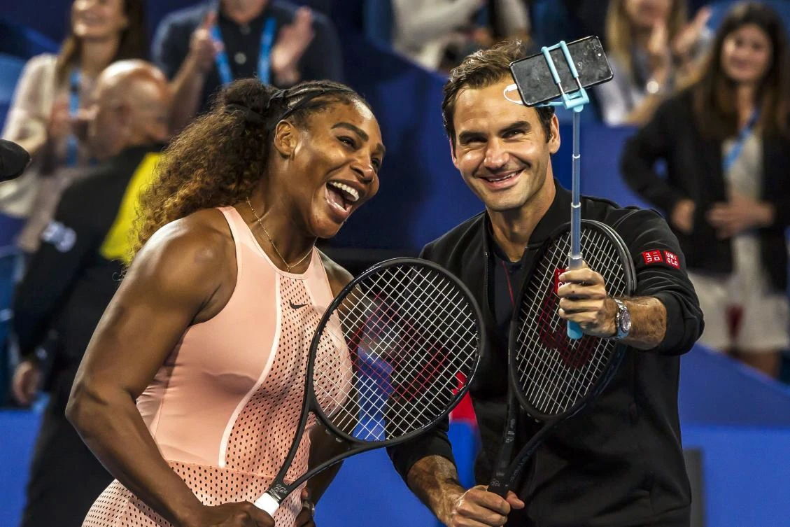 Serena Williams and Roger Federer take a selfie following their mixed doubles match on day four of the Hopman Cup tennis tournament in Perth. (AFP)