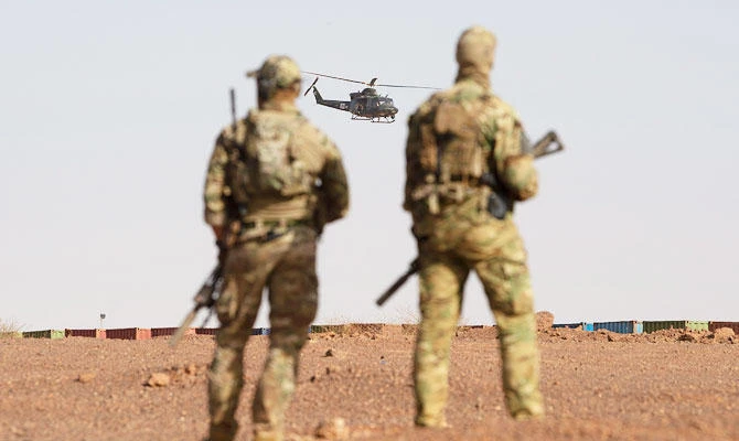 Canadian soldiers watch as a Canadian helicopter provides air security during a demonstration for Prime Minister Justin Trudeau on the United Nations base in Gao, Mali Saturday, Dec. 22, 2018. (AP)
