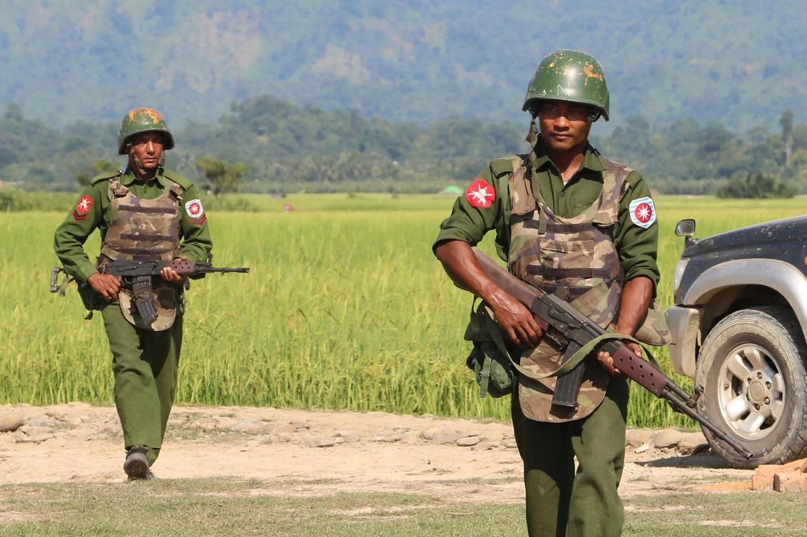 Myanmar says police attacked as western fighting displaces thousands