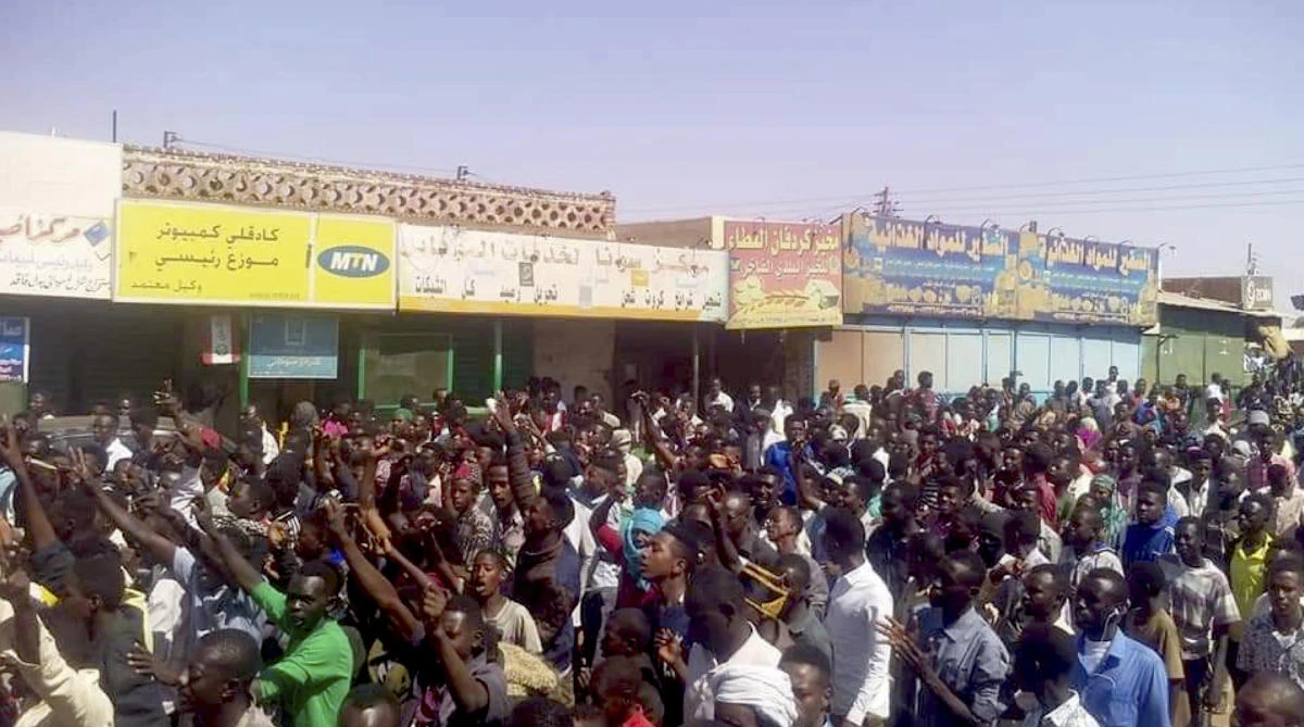 In this Tuesday, Dec. 25, 2018 handout image provided a Sudanese activist, people chant slogans during a demonstration in Kordofan, Sudan. (Sudanese Activist/AP)