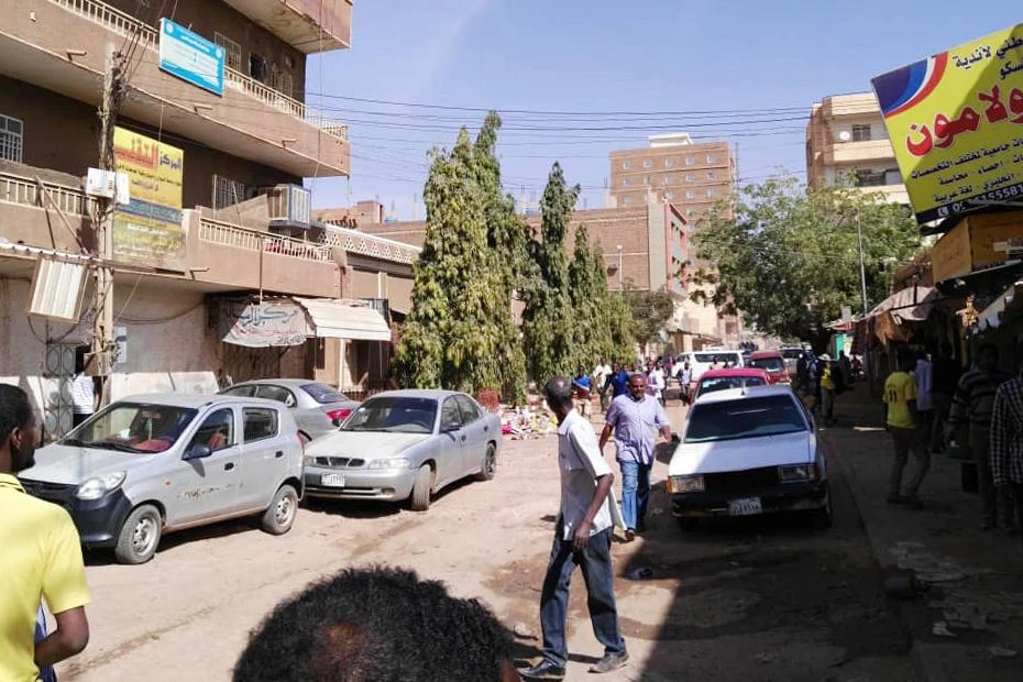 Sudanese protesters run away from tear gas smokes during a demonstration in Khartoum, on December 31, 2018. (AFP)