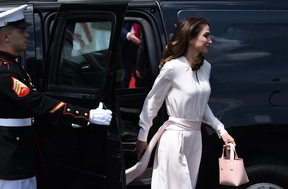 Queen Rania, known for her exquisite style, sometimes uses the borrowing system from fashion houses. (AFP)