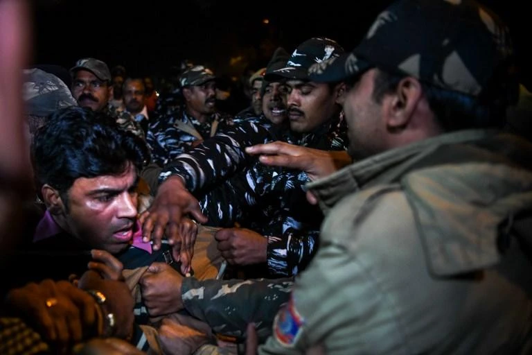 An Indian Hindu activist gets detained by police during a demonstration over two women entering the Sabarimala Ayyapa temple in the southern state of Kerala, in New Delhi on Thursday, January 3. (AFP)