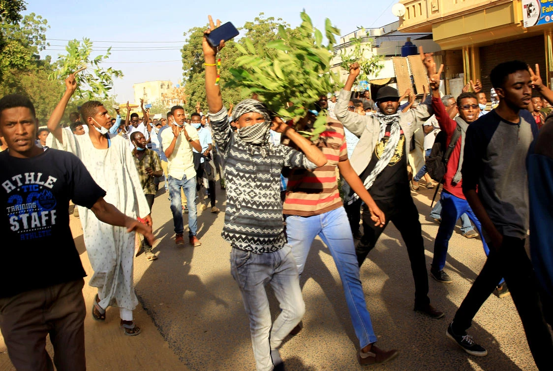 Sudanese demonstrators chant slogans as they march along the street during anti-government protests in Khartoum, Sudan December 25, 2018. (Reuters)