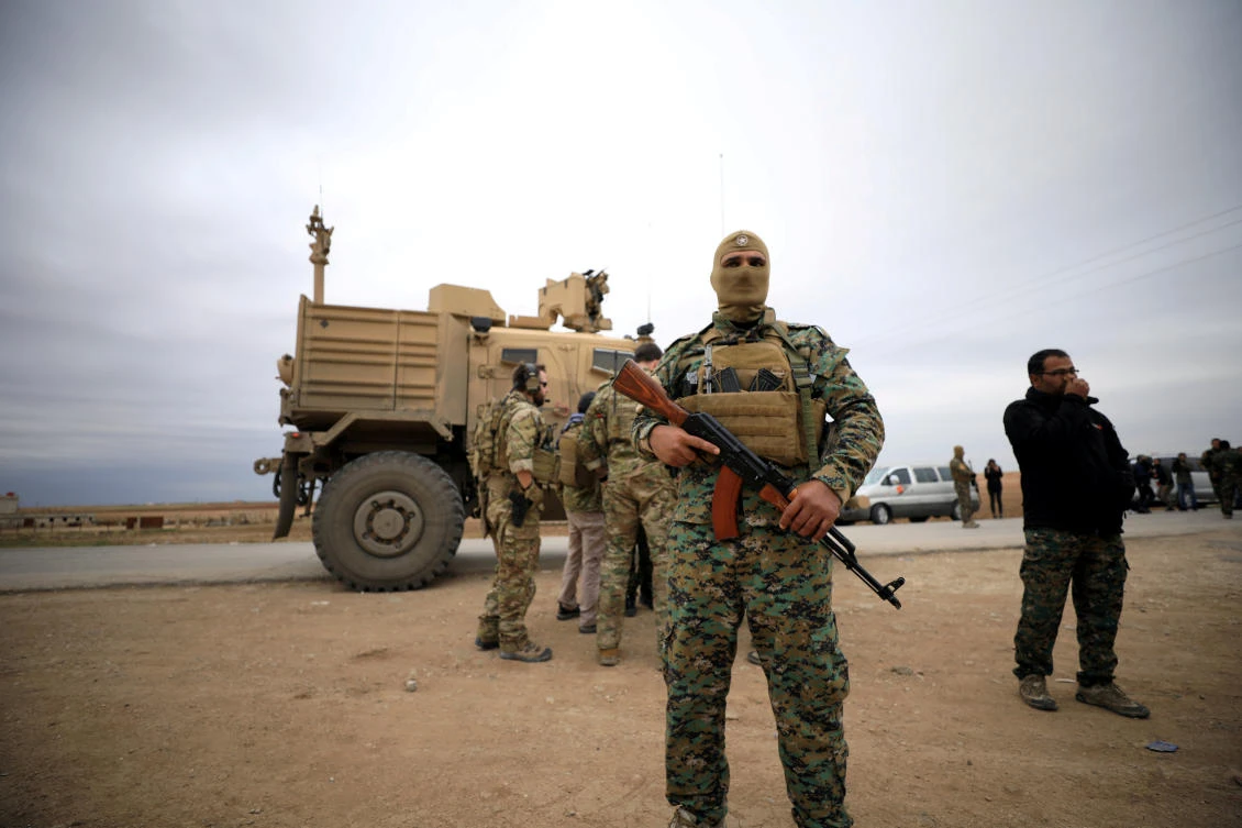 Syrian Democratic Forces and US troops during a patrol near Turkish border in Hasakah, Syria on November 4, 2018. (Reuters)