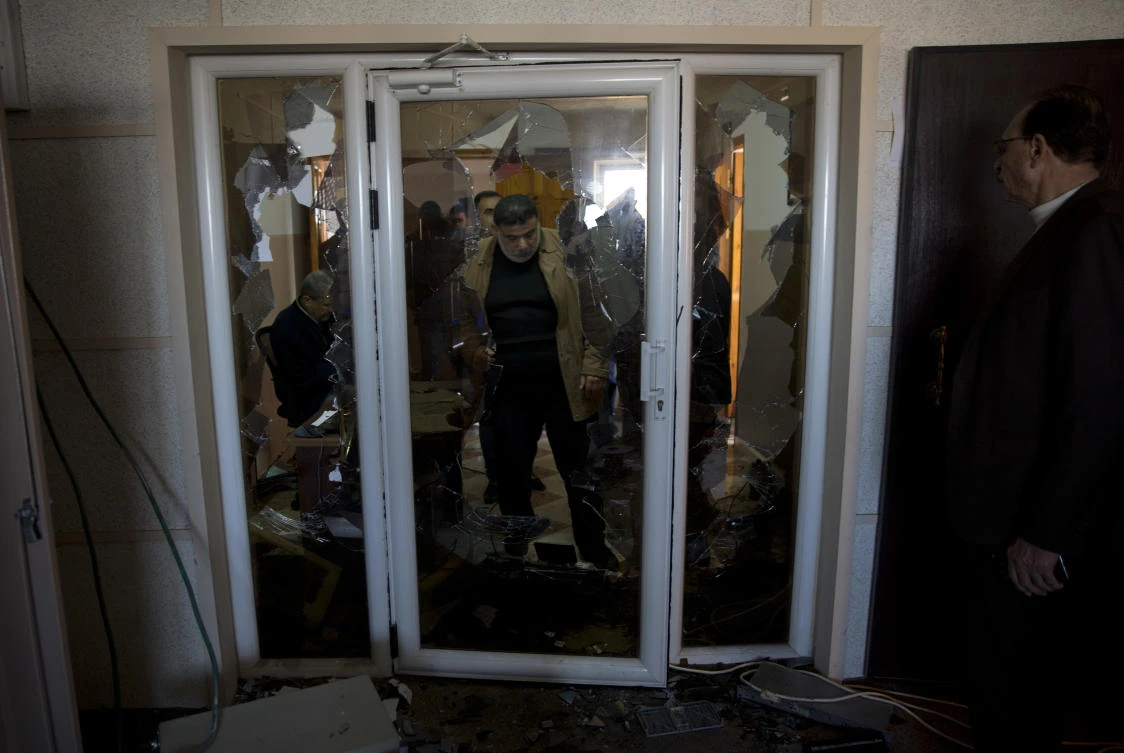 Employees check the damage in a studio after a raid by gunmen on the offices of a Palestinian broadcasting corporation in Gaza City, Friday, Jan. 4, 2019. (AP)