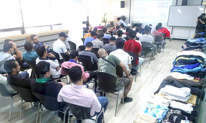 Yemeni refugees wait for a meeting with immigration officials at a refugee center in Jeju, South Korea. (AFP)