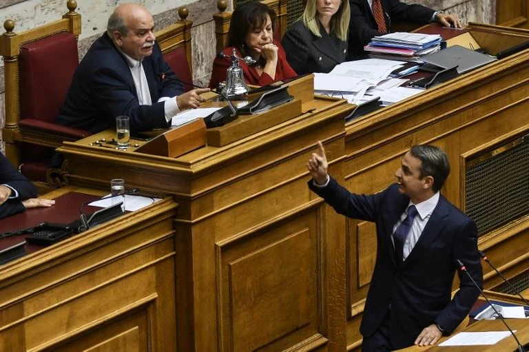 Greek main opposition leader Kyriakos Mitsotakis, right, dismissed government accusations of kickbacks allegedly pocketed by his party while in power prior to 2015 as ‘savage propaganda.’ (AFP)