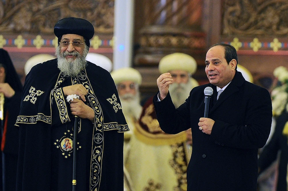 Abdel-Fattah El-Sisi accompanied by Coptic Pope Tawadros II, during Christmas Eve Mass at the new "Cathedral of the Nativity of Christ," in the new administrative capital. (AP)