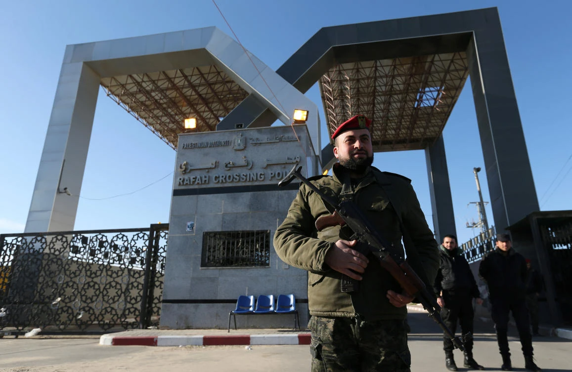 A member of Palestinian security forces loyal to Hamas stands guard at the gate of Rafah border crossing. (Reuters)
