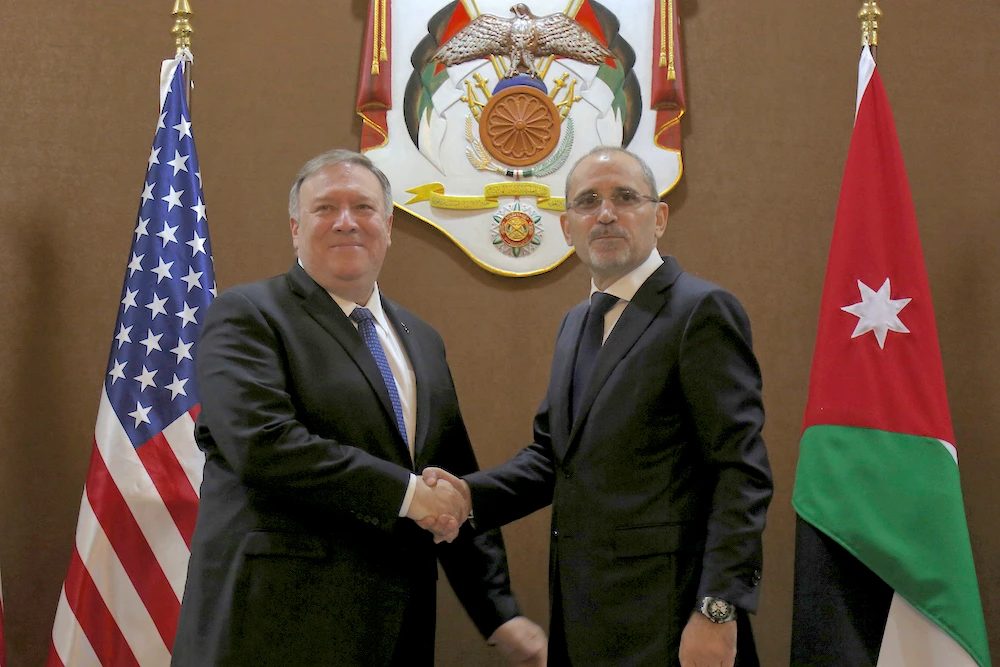 US Secretary of State Mike Pompeo, left, and Jordan's Foreign Minister Ayman Safadi shake hands, in Amman, Jordan, Tuesday, Jan. 8, 2019. (AP)