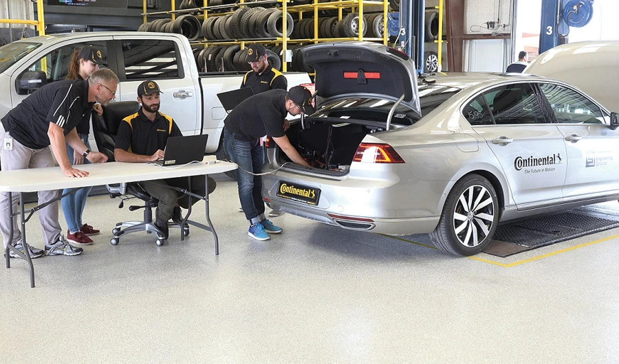 The Continental team working on the prototype for an automated tire testing vehicle.