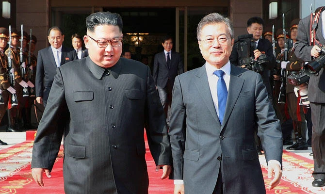 In this May 26, 2018, file photo provided by South Korea Presidential Blue House, North Korean leader Kim Jong Un, center left, and South Korean President Moon Jae-in, right, walk after their meeting at the northern side of Panmunjom in North Korea. (AP)