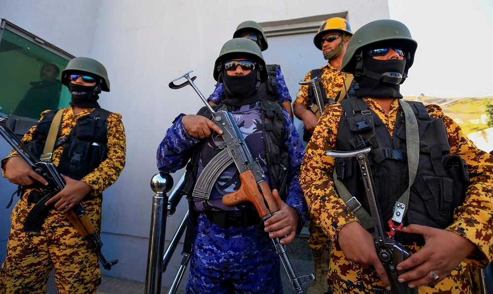 Yemeni security forces loyal to the Houthis stand guard during a demonstration outside the United Nations office in the capital Sanaa on December 10, 2018. (File/AFP)