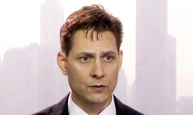 In this file image made from a video taken on March 28, 2018, Michael Kovrig, an adviser with the International Crisis Group, a Brussels-based non-governmental organization, speaks during an interview in Hong Kong. (AP)