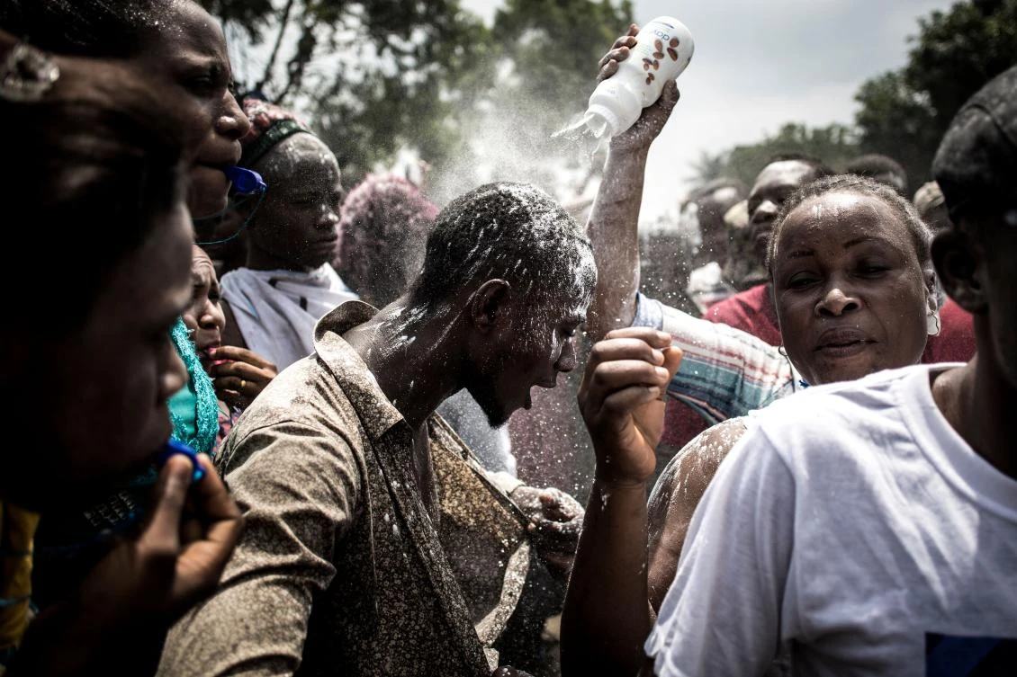 Congo’s electoral commission has said opposition leader Felix Tshisekedi won with 38 percent of the vote while runner-up Martin Fayulu received 34 percent. Above, Tshisekedi supporters celebrate his win with talcum powder. (AFP)