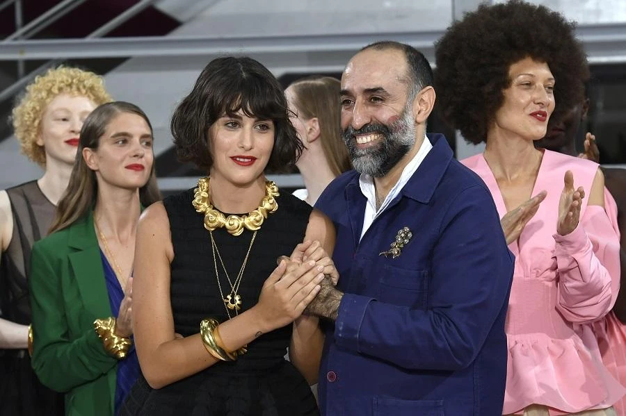 Lebanon fashion designer Rabih Kayrouz acknowledges the audience at the end of his 2018-2019 Fall/Winter Haute Couture collection fashion show in Paris, on July 2, 2018. (AFP)