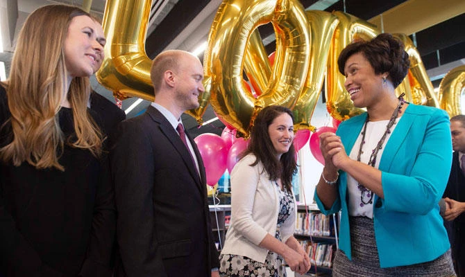 Mayor Muriel Bowser of Washington, DC, greets couples unable to obtain marriage licenses because of the partial federal government shutdown after signing the "Let Our Vows Endure Emergency Act of 2019," or "LOVE Act," which gives the mayor the authority to issue marriage licenses, following a signing ceremony in Washington, DC, January 11, 2019. (AFP)