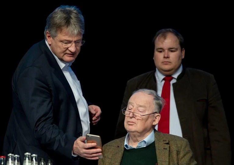 From left: Alternative for Germany leader Joerg Meuthen share information on a mobile phone with Alexander Gauland and Torben Braga during the party’s meeting on January 13, 2019. (AFP)