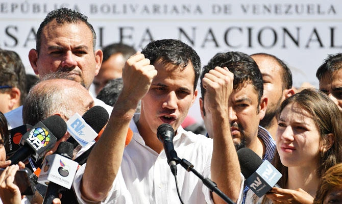 Venezuela's National Assembly president Juan Guaido gestures as he speaks before a crowd of opposition supporters during an open meeting in Vargas, Venezuela, on January 13, 2019. (AFP)