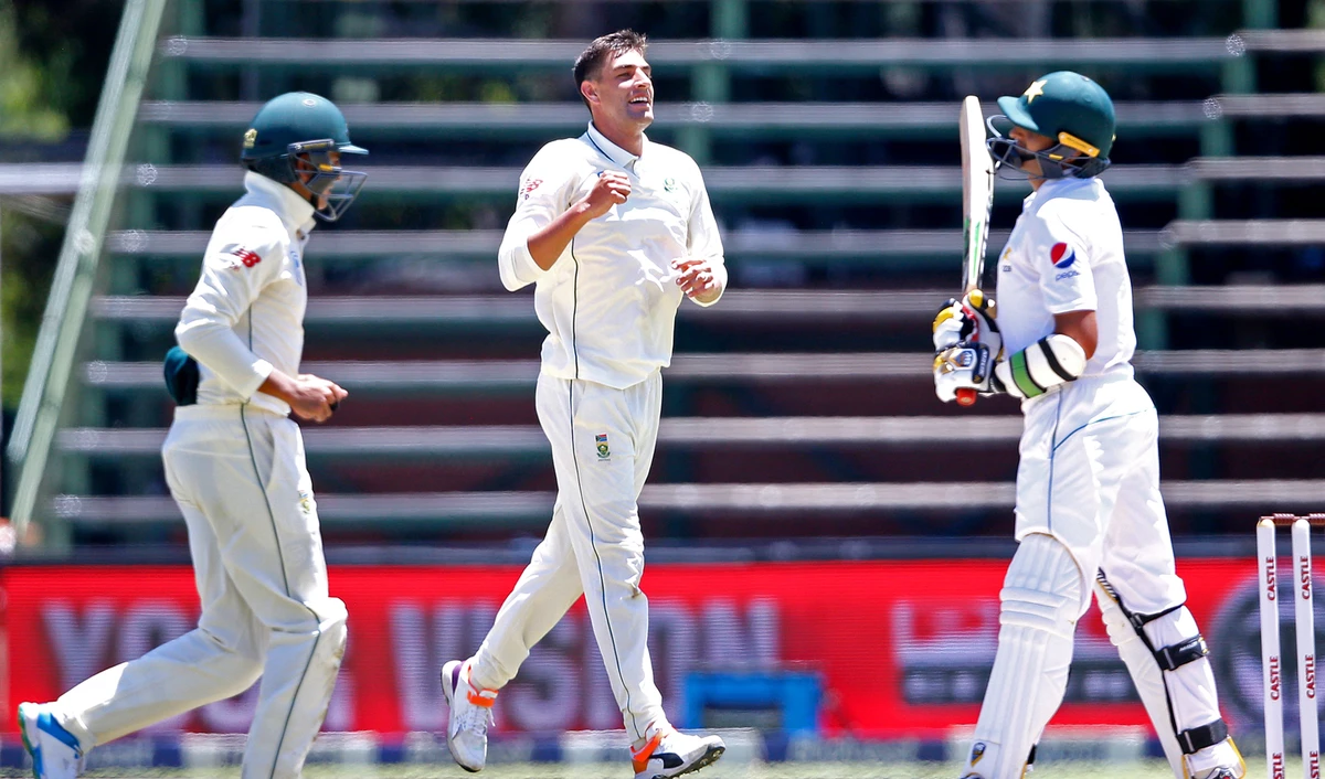 South African bowler Duanne Olivier, center, celebrates during the second day of the third Cricket Test match between South Africa and Pakistan in Johannesburg, South Africa on Jan. 12, 2019. (AFP)