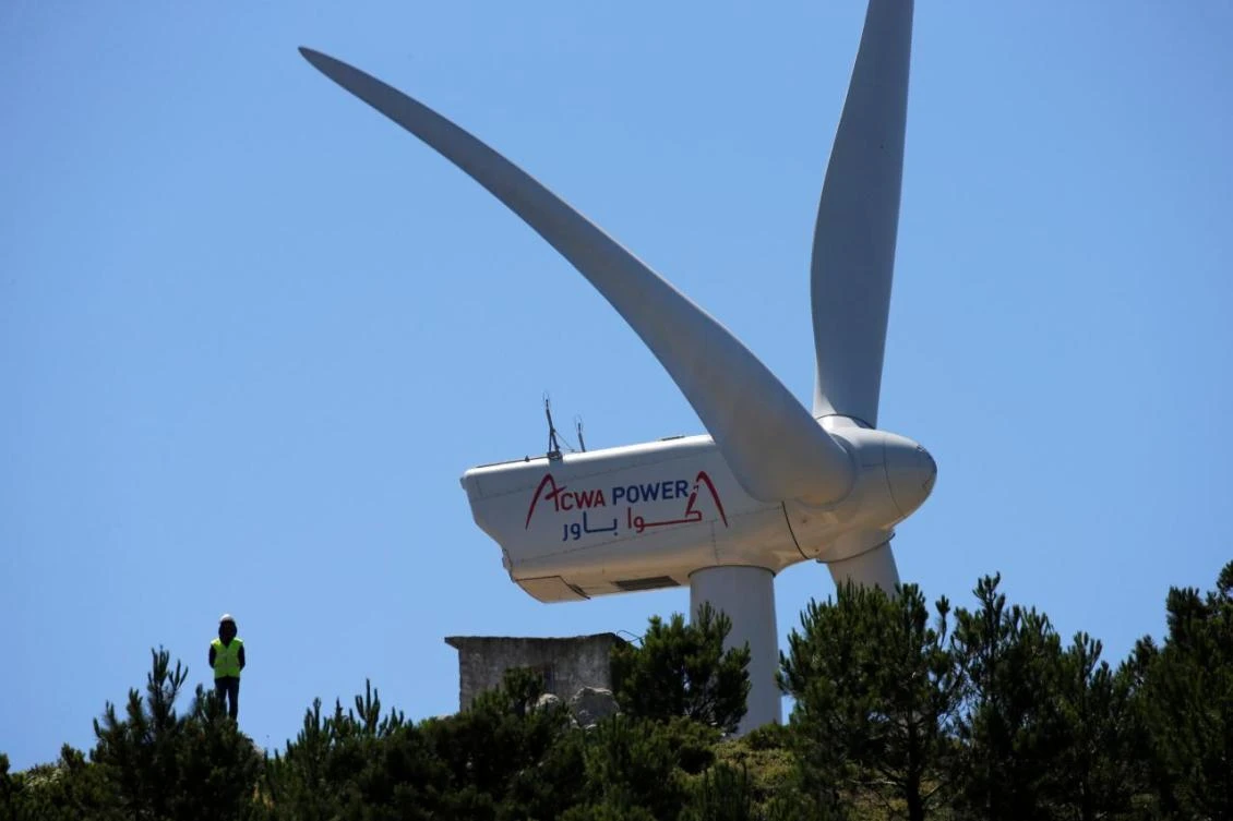 Riyadh-based ACWA Power is partly owned by Saudi Arabia’s Public Investment Fund. Above, an ACWA windmill in Jbel Sendouq, on the outskirts of Tangier, Morocco. (Reuters)