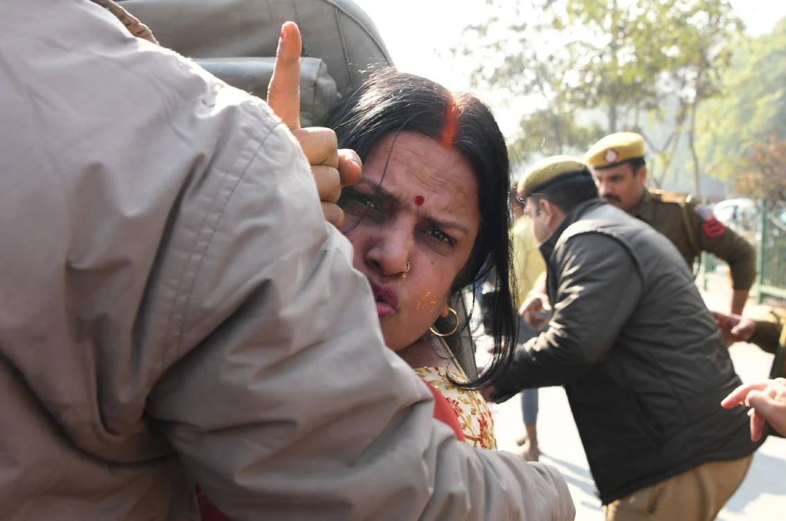 Police officers detain a Hindu protester shouting slogans outside the Indian Supreme Court on Thursday, January 10, after the hearing in the Ayodhya temple dispute case was further deferred to January 29. (AFP)