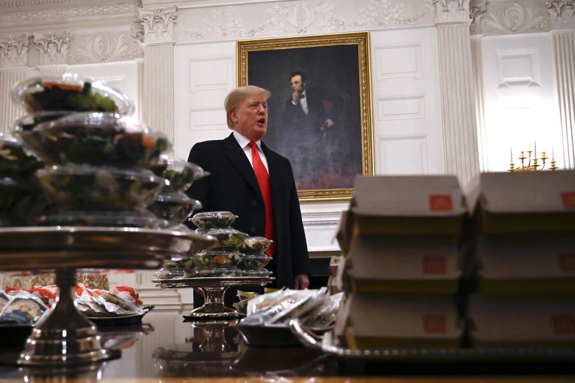 President Donald Trump talks about the table full of fast food during a reception for the 2018 college football playoff National Champion Clemson Tigers on Monday, January 15. (AP)