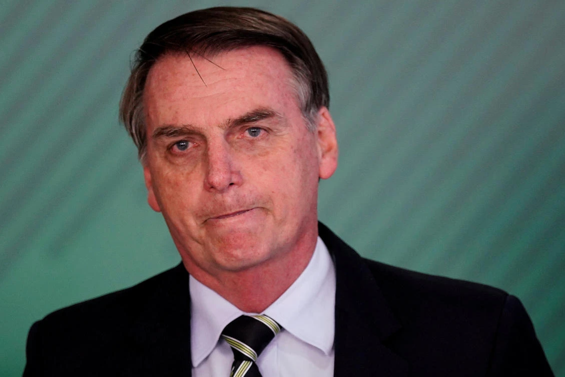Brazil's President Jair Bolsonaro reacts during a signing ceremony of the decree which eases gun restrictions in Brazil, at the Planalto Palace in Brasilia, Brazil January 15, 2019. (Reuters)