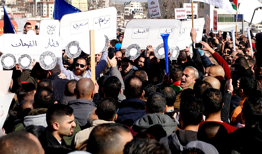 Palestinians take part in a protest against a social security law in Ramallah, in the Israeli-occupied West Bank on Jan. 15, 2019. (Reuters)