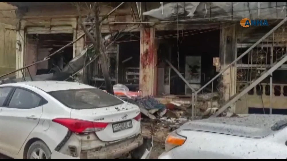 The aftermath of a suicide attack in the northern Syrian town of Manbij. (AFP from Hawar News Agency video)