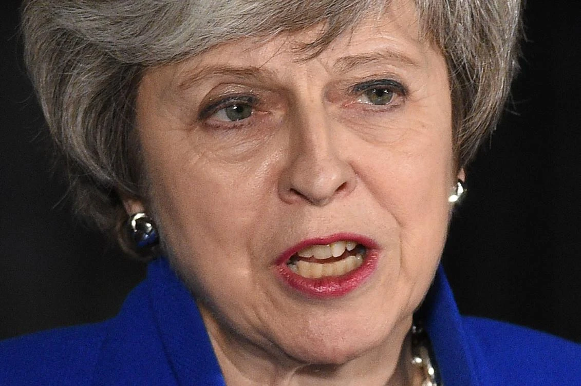 Britain's Prime Minister Theresa May delivers a statement to members of the media in Downing Street in London on January 16, 2019, after surviving a vote of no confidence in her government. (AFP)