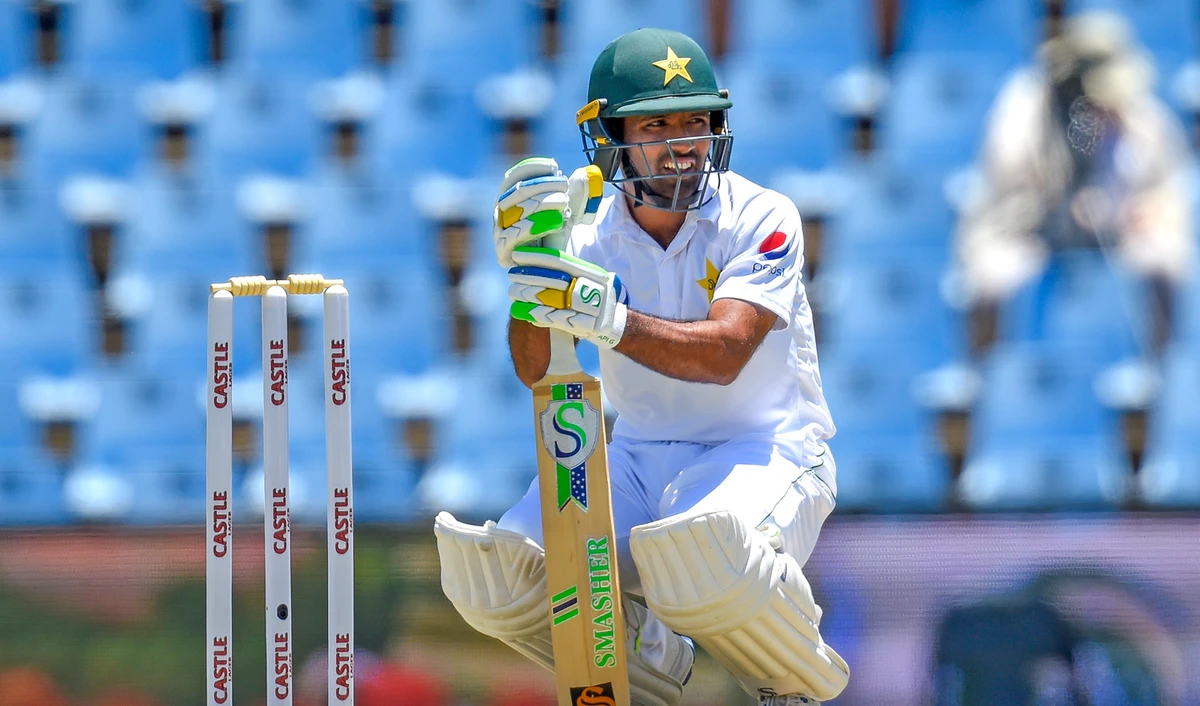 In this file photo, Pakistan’s Asad Shafiq squats at the wicket during day one of the 1st cricket test match between South Africa and Pakistan in Pretoria on Dec. 26, 2018. (AFP)